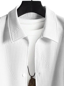 Macro shot of white textured casual jacket with geometric jacquard and button-down collar