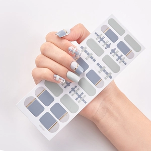 Close-up of SS-031 nail stickers with grey, blue, plaid, and gold line designs