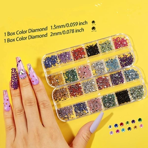 Detail view of 1.5mm and 2mm colorful acrylic nail art rhinestones in two organized cases