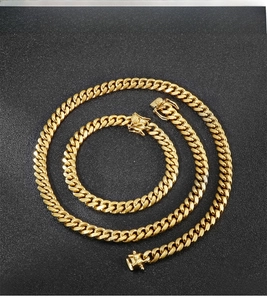 Close-up of 8mm golden Cuban link chain set showing detailed flat links and clasp lock