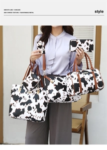 Detailed view of 6-piece fashion handbag set featuring stylish cow print and brown straps