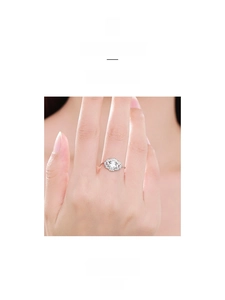 Detailed view of S925 sterling silver ring with pavé-set zircons on a model's finger