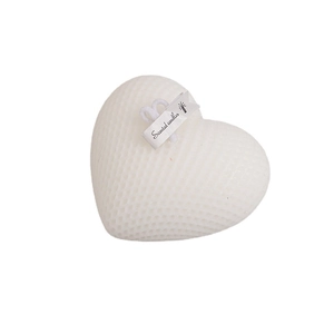 White heart-shaped scented candle with honeycomb texture and minimalist paper label