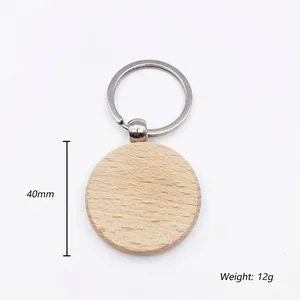 Detail view of a 40mm round beech wood keychain with 12g weight and metal ring