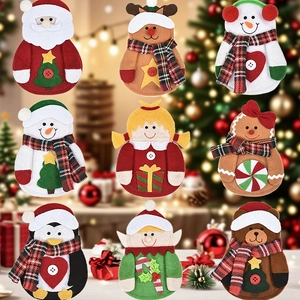 Macro view of Christmas felt cutlery holders featuring Santa, snowman, and reindeer motifs