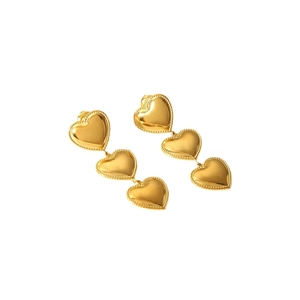 Polished 18k gold heart drop earrings with beaded edges and triple stacked heart design