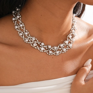 Detail of double-layer silver choker necklace featuring white pearls and rhinestones