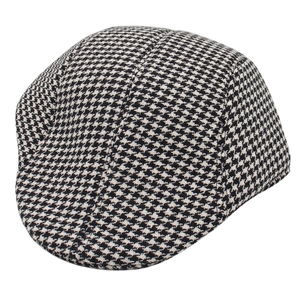 Classic black and white houndstooth flat cap in vintage style for elegant gentlemen