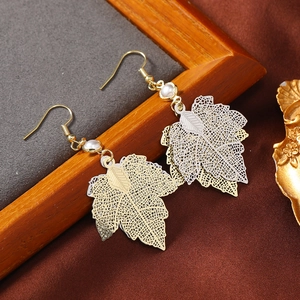 Exaggerated double-layered gold and silver hollow maple leaf earrings with pearl detail