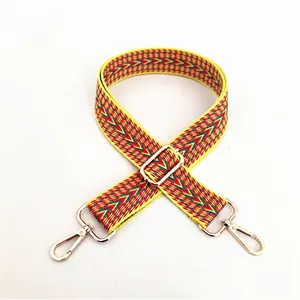 Ethnic style yellow cotton woven bag strap with colorful V-shape patterns and gold metal clips