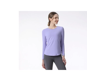 Detail of light purple long sleeve yoga top featuring breathable quick-dry fabric texture
