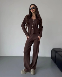 Detail of V-neck brown knitted cardigan and high-waisted wide-leg trousers set