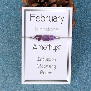 Detail of February birthstone amethyst bracelet with irregular stones on a gift card