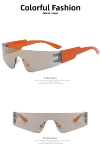 Detail view of futuristic wrap-around sunglasses with orange temples and gold mirrored lenses