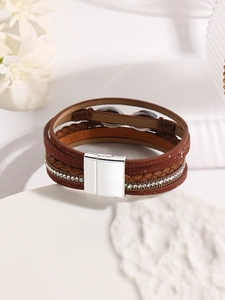 Detail view of brown multilayer leather bracelet with rhinestones and magnetic buckle
