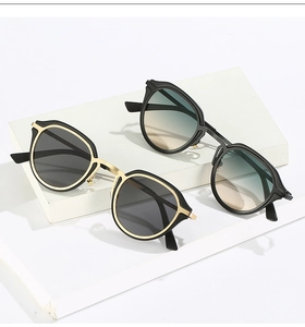 Detail view of oval cat-eye sunglasses frames showing size parameters on metal temples