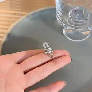 Minimalist silver paperclip ear cuff for women featuring pave-set white cubic zirconia