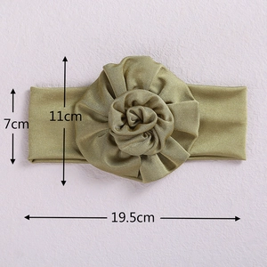 Olive green baby headband with soft fabric flower decoration and 7x19.5cm dimensions