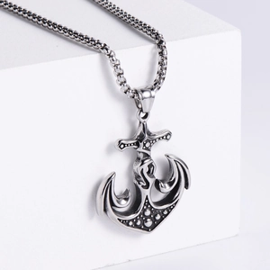 Men's stainless steel anchor pendant necklace with box chain on a minimalist white stand