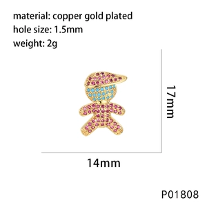 Macro shot of boy-shaped pendant in gold-plated copper with pink and blue pavé zircon