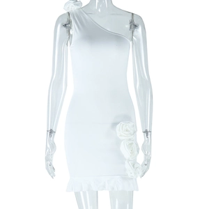Detail showing the white one-shoulder mini dress with 3D rose and ruffle hem details