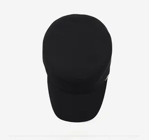 Top-down view of black flat top military cap showing textured fabric and stitching