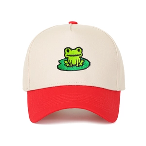 Close-up of red and white trucker hat with embroidered frog on a lily pad detail