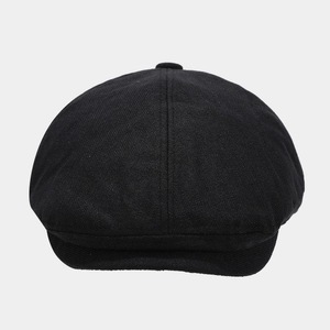Retro black linen newsboy cap with classic woven texture and minimalist vintage design