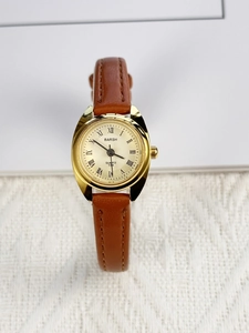 Detail of BARSH women's watch featuring champagne dial and brown leather strap