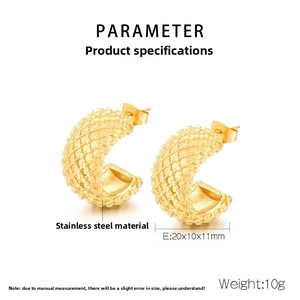 Detail view of irregular C-shaped gold stainless steel earrings with textured surface