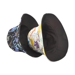 Double-sided bucket hat set with colorful cartoon dinosaur prints in black and cream white