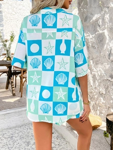 Detail of bohemian shirt back with blue-green plaid and starfish patterns on stone terrace