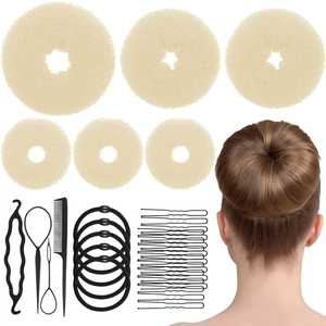 Hair styling kit with beige sponge bun makers, bobby pins, and tail comb for updo hair