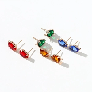 Detail view of colorful drop-shaped zircon earrings with hanging loops for DIY jewelry