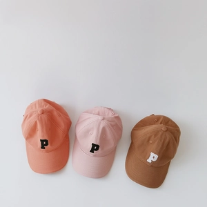 Detailed embroidery of letter P on colorful cotton baseball caps for kids and babies