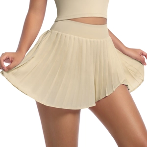 Detail view of khaki pleated tennis skirt featuring moisture-wicking fabric and pockets