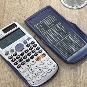 Detailed view of scientific calculator cover with unit conversion table and constant list