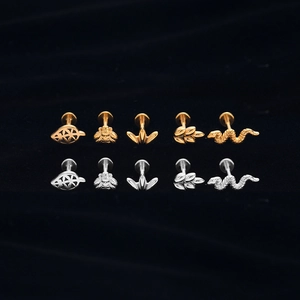 Detailed collection of bee, leaf, and snake body piercings in gold and silver finish