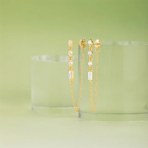 Detailed shot of gold-plated silver heart earrings with sparkling cubic zirconia stones