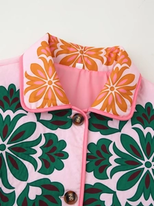 Detail of pink floral cotton jacket featuring vintage prints and tortoiseshell buttons