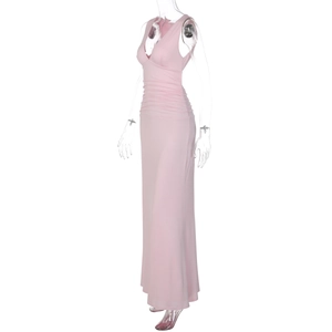 Side view of pink sleeveless maxi dress with deep V-neck and elegant ruched details
