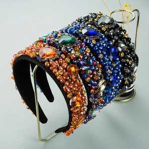 Close-up of luxury knotted headbands featuring colorful rhinestones and crystal beads