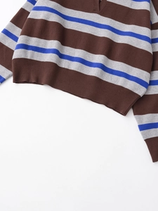 Detailed close-up of ribbed cuffs and hem on the vintage striped knit polo sweater