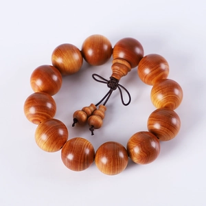 Polished brown Thuja Sutchuenensis wood bead bracelet with natural grain and buddha head