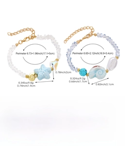 Detail of colorful ceramic beaded bracelet set with starfish and seashell charms