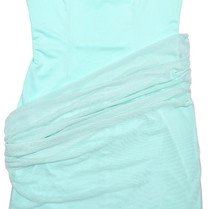 Close-up of mint green ruched tulle fabric on a sexy bodycon spaghetti strap dress