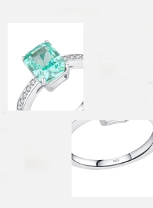 Macro shot of S925 sterling silver ring with 5A emerald-cut green zircon and hand-set pavé