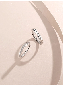 Macro shot of S925 sterling silver Mobius rings showing the hallmark and stones