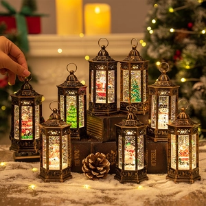 Vintage bronze Christmas lantern with LED lights and Santa Claus in a snowy scene