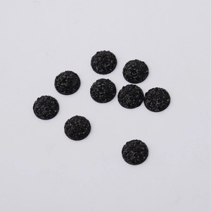Detailed view of nine 12mm black round resin druzy stones for jewelry making